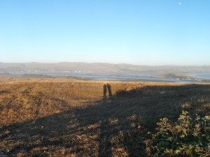 Looking over the bay side toward town with our shadows in the distance.